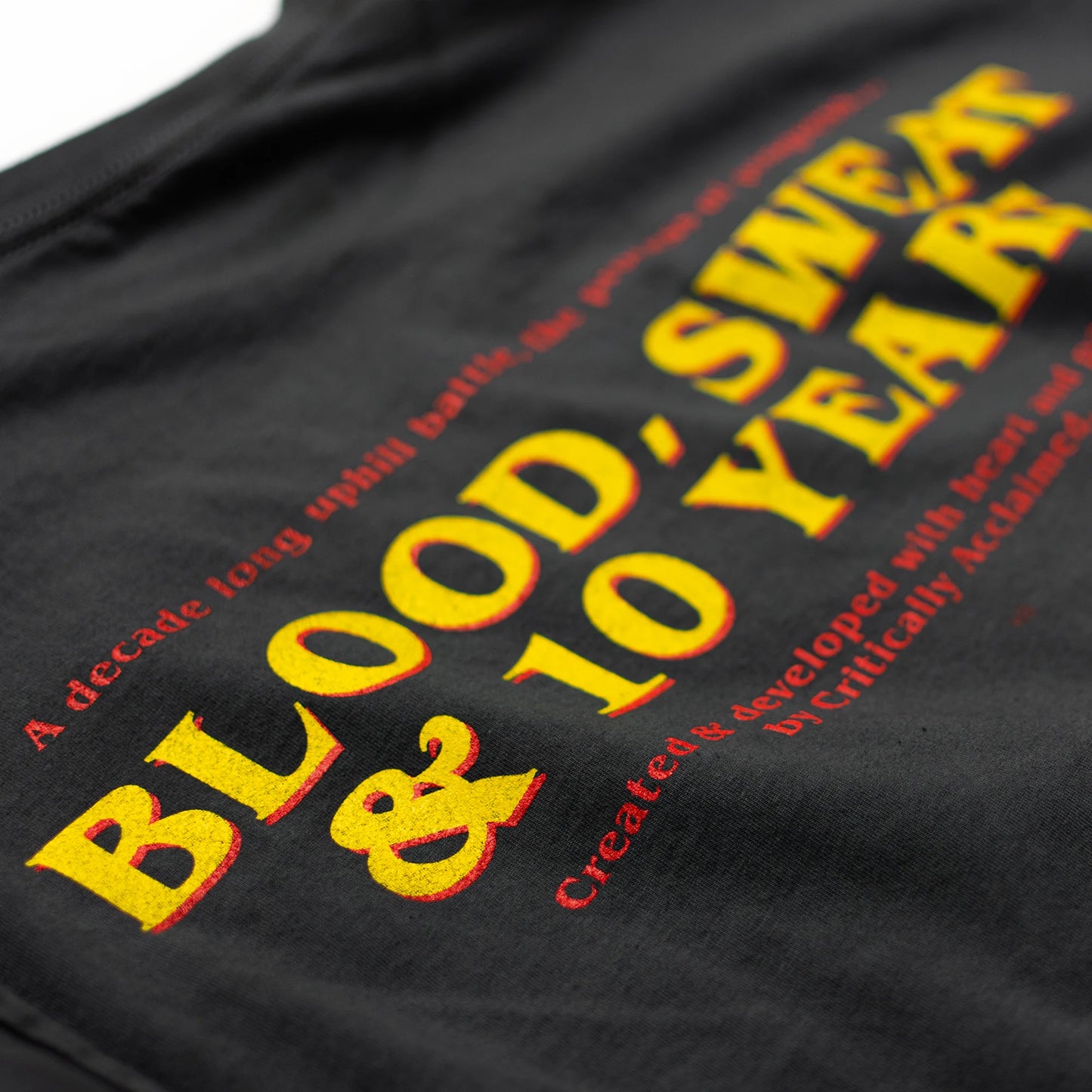 Critically Acclaimed 10th Anniversary T-Shirt Back Print Close-Up