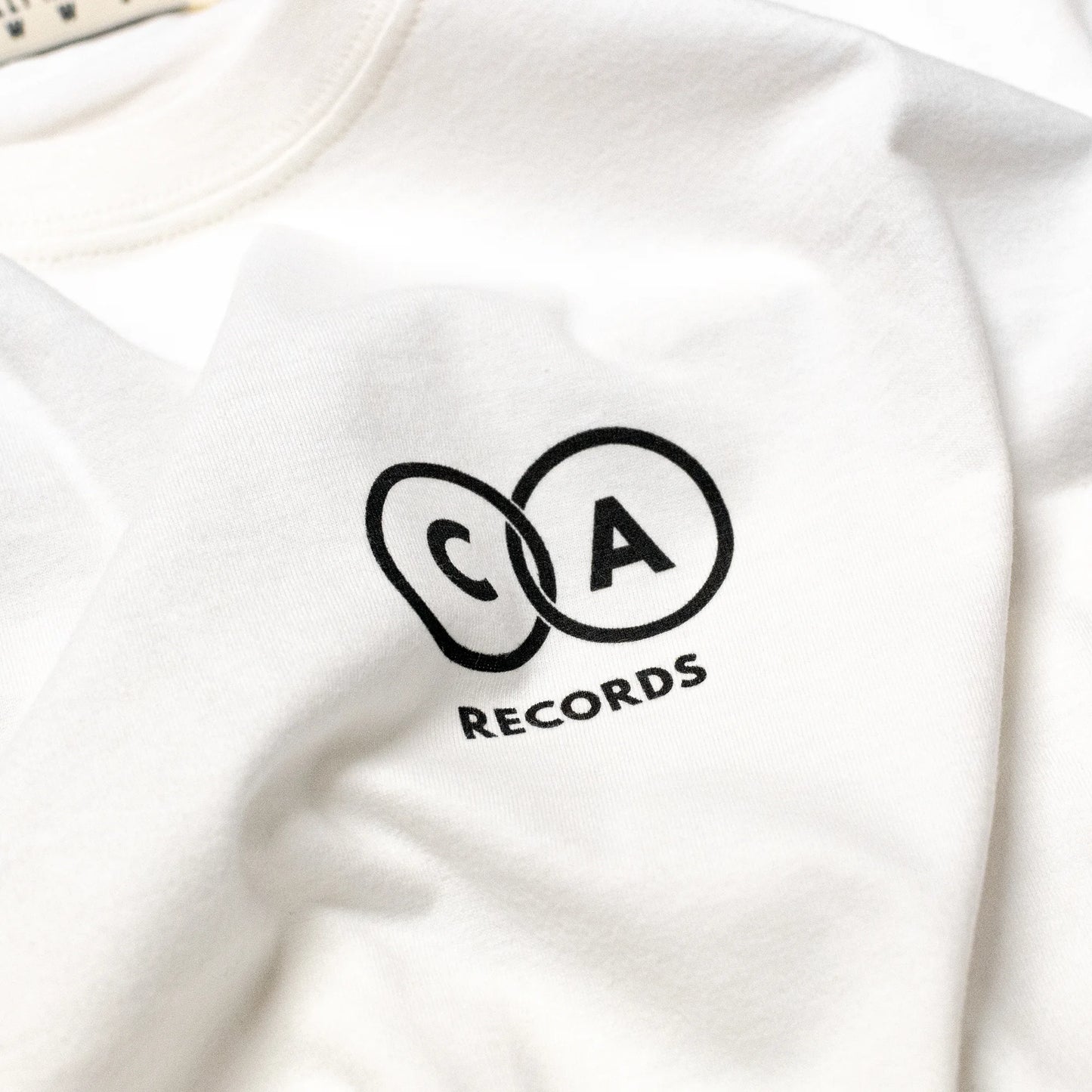 Vintage White Vinyl Record Revolution Graphic T-Shirt Front Close-Up