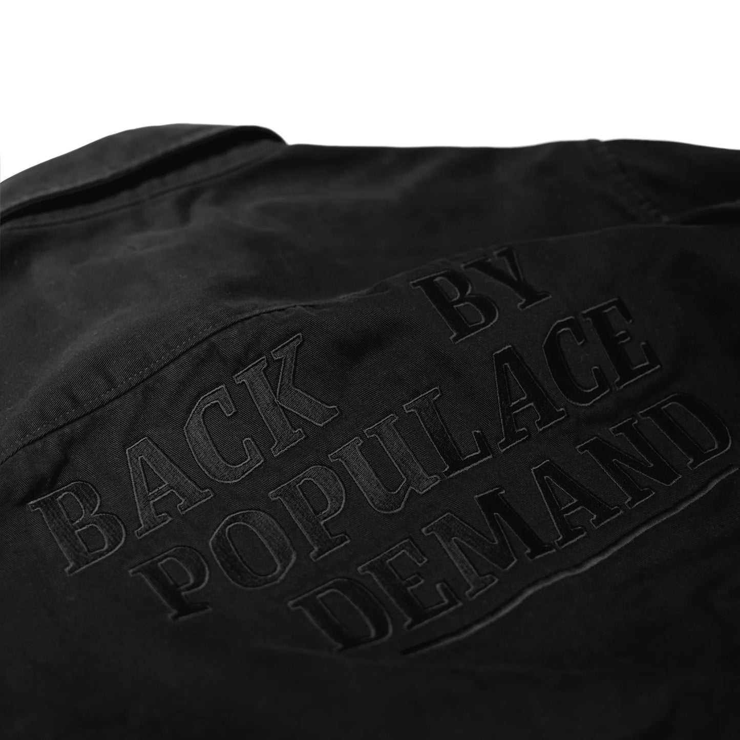 Black canvas overshirt embroidery close-up