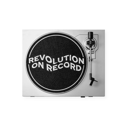 Black felt slipmat for vinyl records with Revolution on Record print on a turntable player.